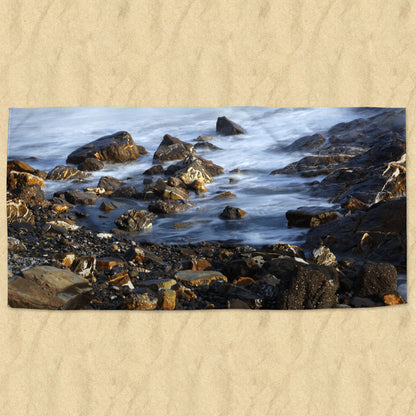 Beach towel photo of a rocky beach | Opposite Home