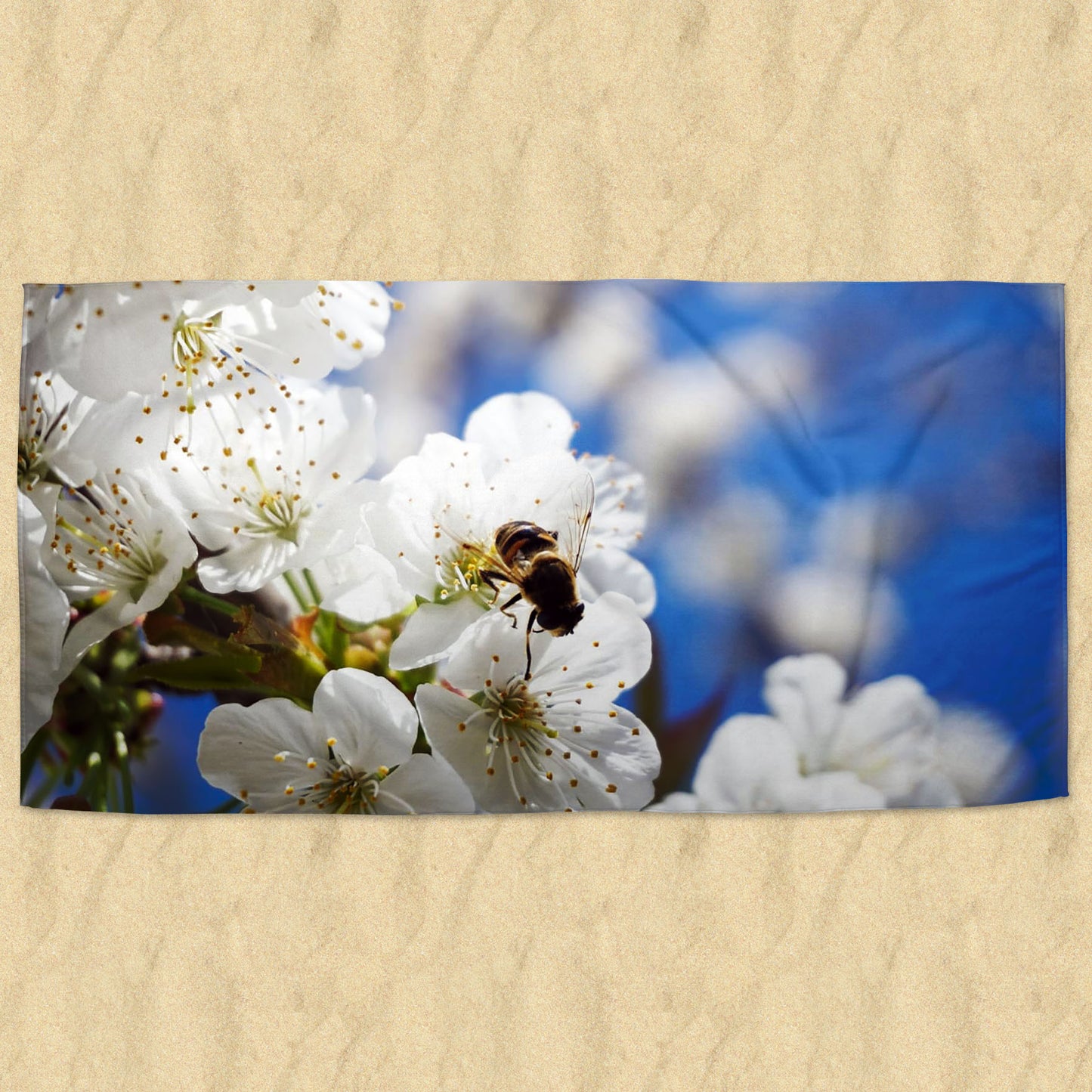 Beach towel photo of bee on cherry blossoms | Opposite Home