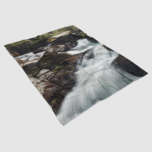 Lightweight fleece blanket with photo print of a mountain waterfall - practical and warm