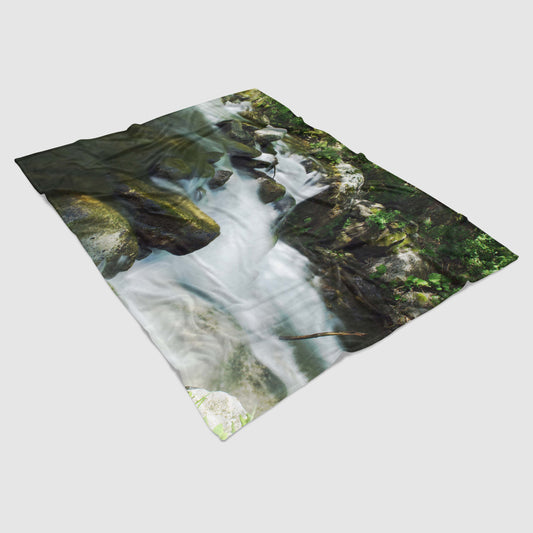 Lightweight fleece blanket with photo print of a mountain river - magical and fairytale environment